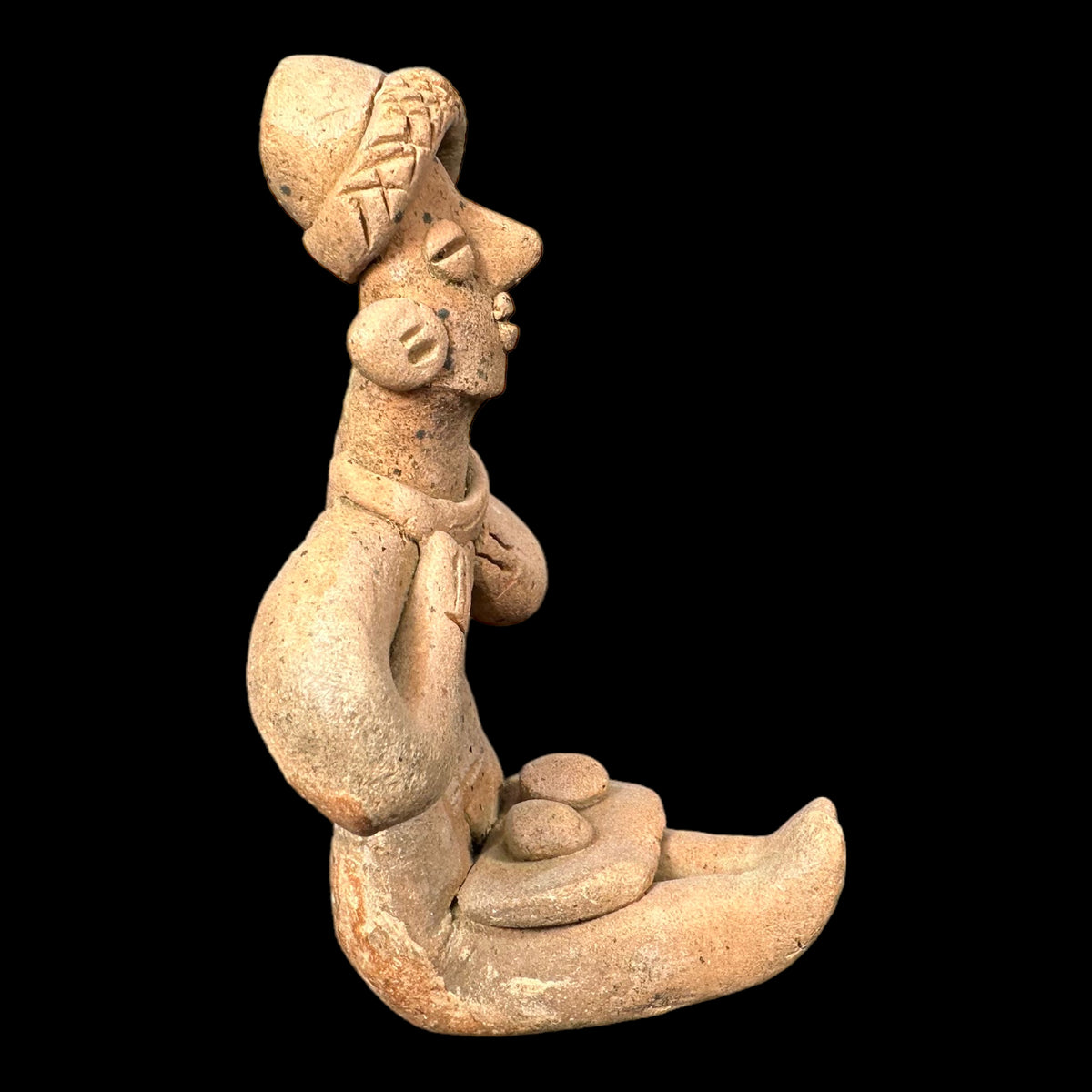 Pre-columbian Colima pottery seated female figure